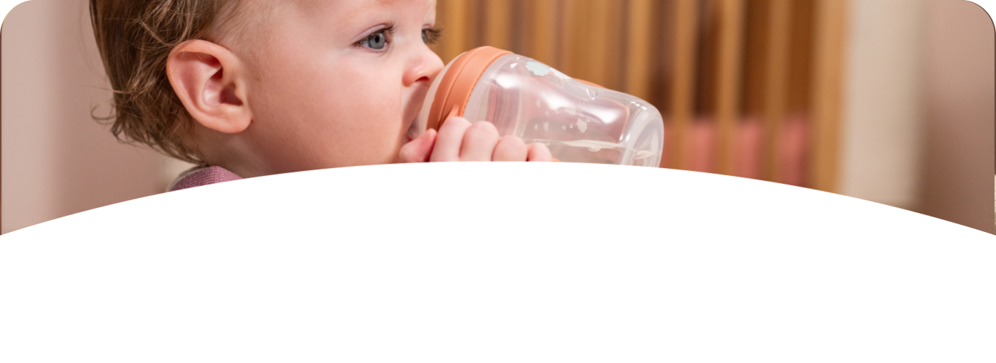 Baby with Learner Bottle