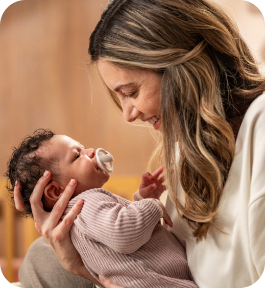 Mother with baby and soother