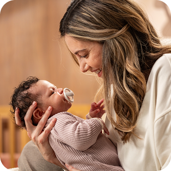 Mother with baby and soother