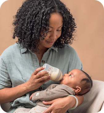 Mother with baby and baby bottle