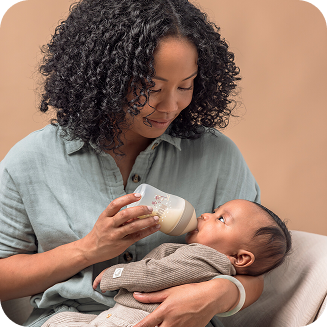 Mother with baby and baby bottle