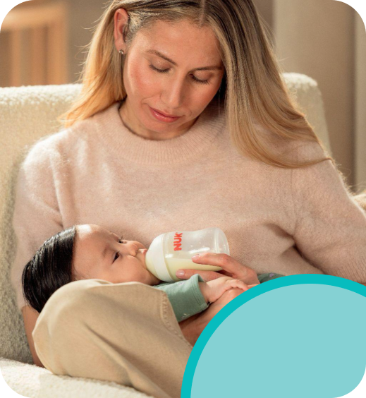 Mother with baby and baby bottle