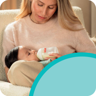 Mother with baby and baby bottle